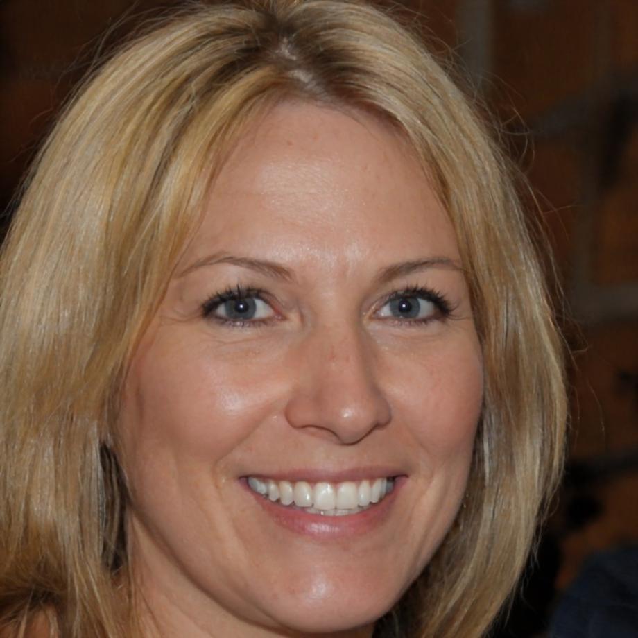 Workshop-Leiterin im Gespräch mit Teilnehmern